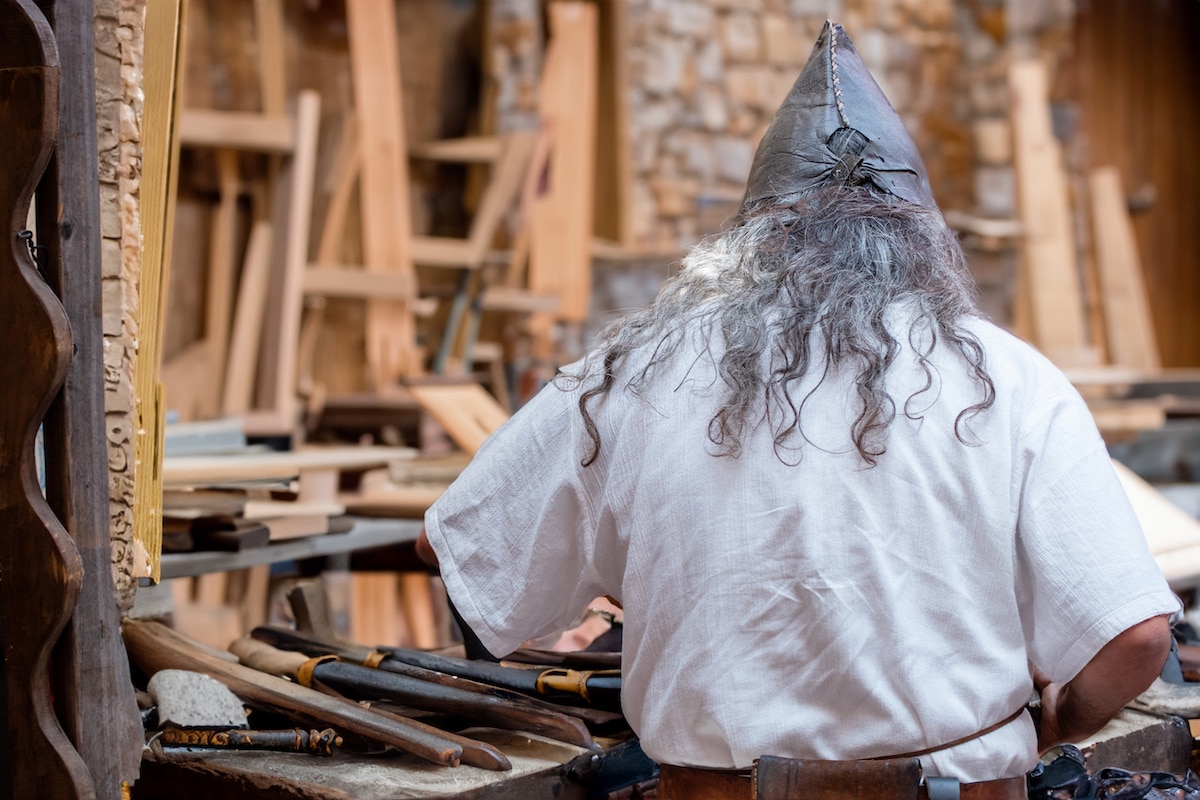 Medieval carpenter working at market stall at the Arkansas Renaissance Festival.